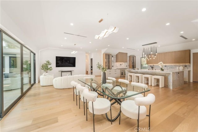 dining space featuring light wood-type flooring