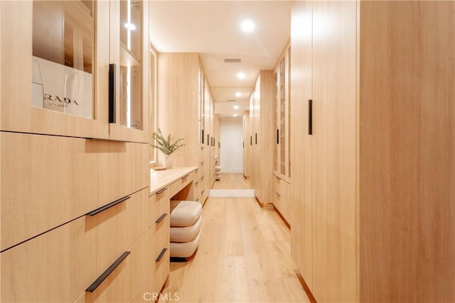 hall with light hardwood / wood-style floors