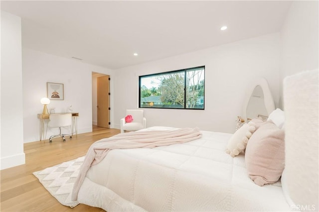 bedroom featuring wood-type flooring