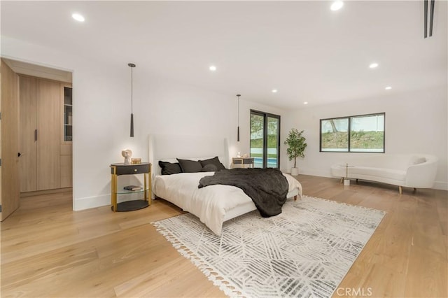 bedroom with light hardwood / wood-style flooring