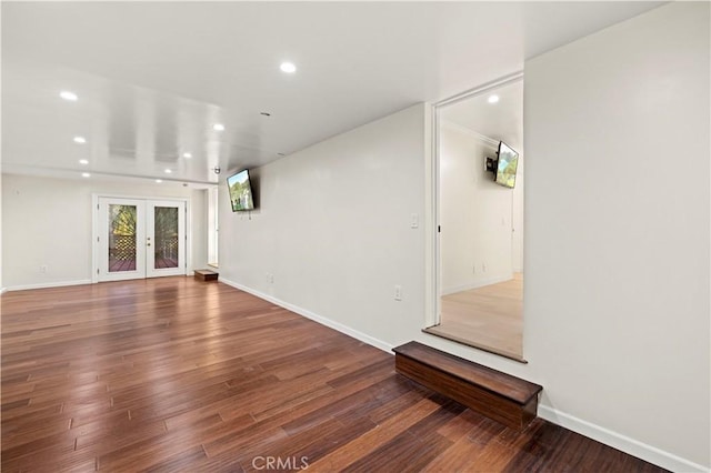 interior space with hardwood / wood-style floors and french doors