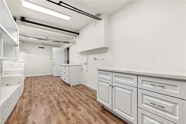 walk in closet featuring light wood-type flooring