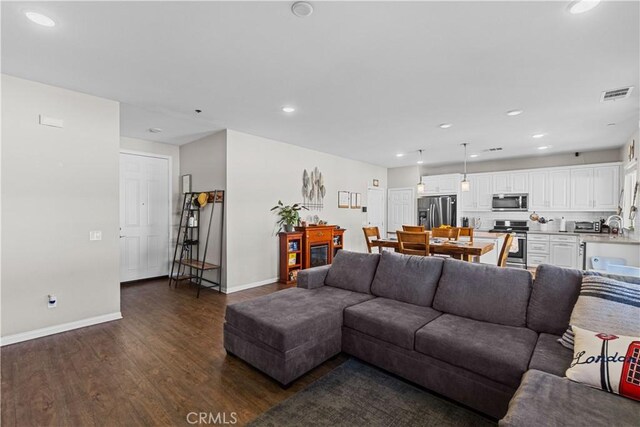 living room with dark wood-type flooring