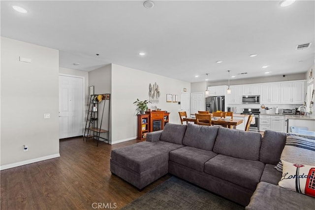 living room featuring dark hardwood / wood-style flooring