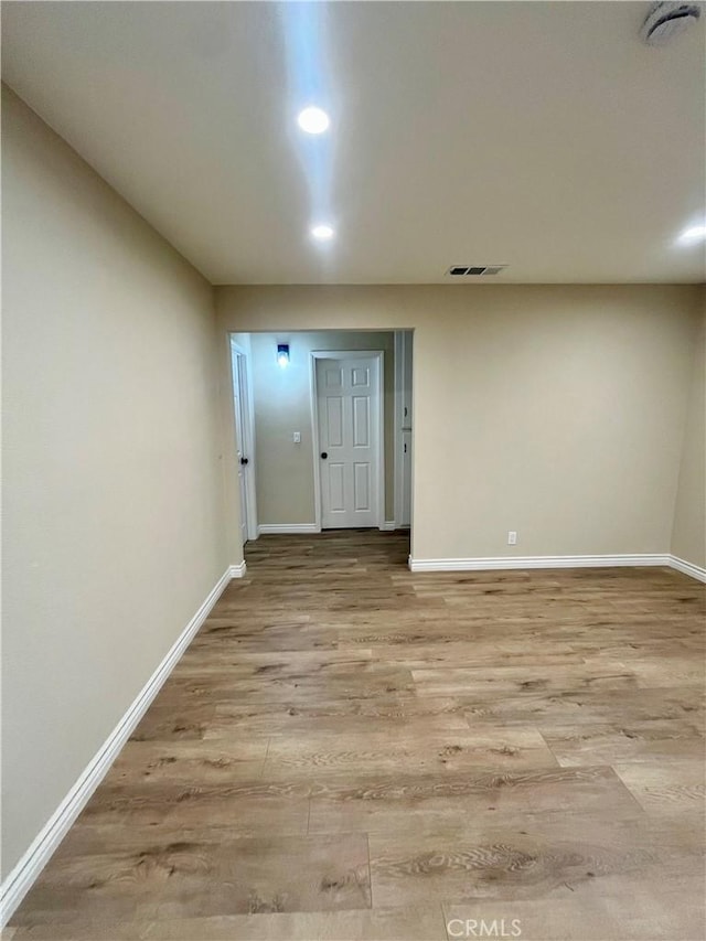 unfurnished room with light hardwood / wood-style floors