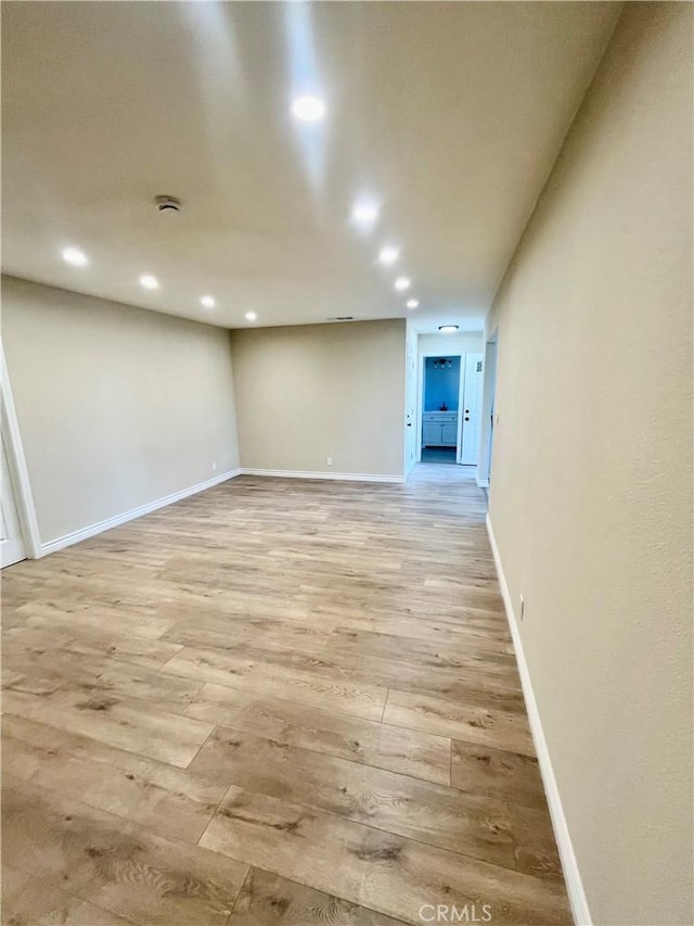 spare room with light wood-type flooring