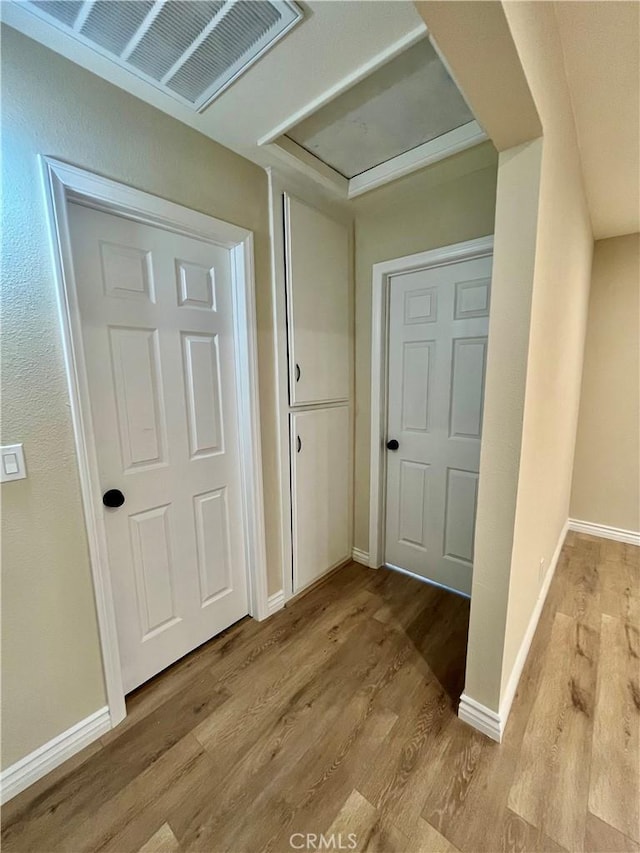 corridor featuring light hardwood / wood-style floors