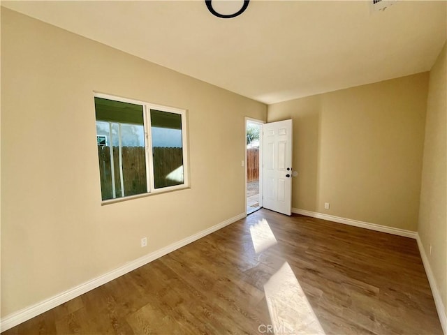 spare room featuring hardwood / wood-style floors