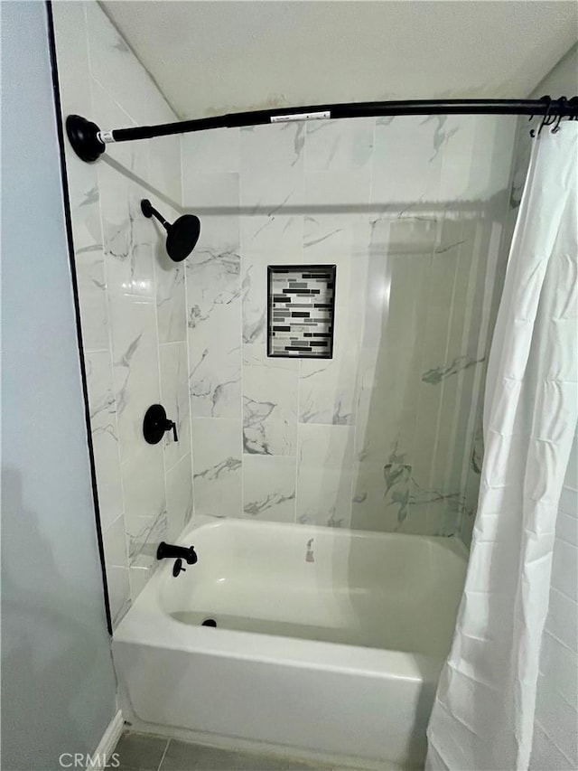 bathroom featuring tile patterned floors and shower / tub combo with curtain