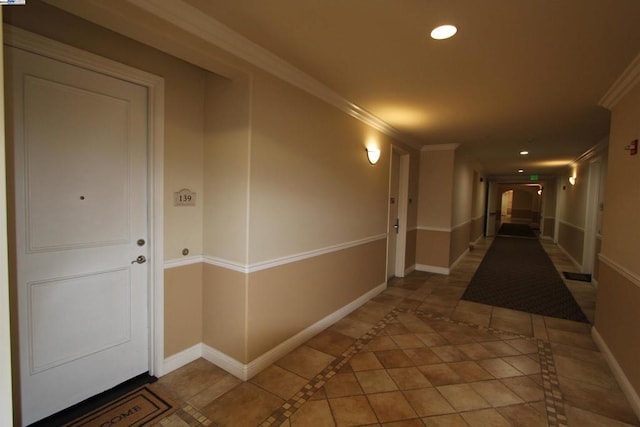 hallway featuring ornamental molding