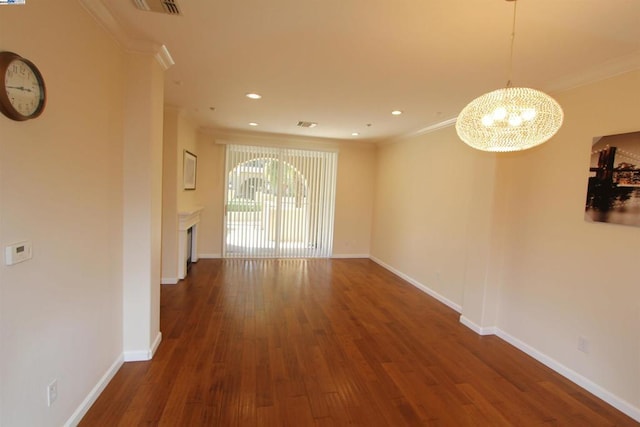 interior space with crown molding, dark hardwood / wood-style floors, and an inviting chandelier