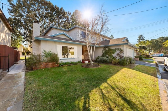 view of front of home with a garage and a front yard