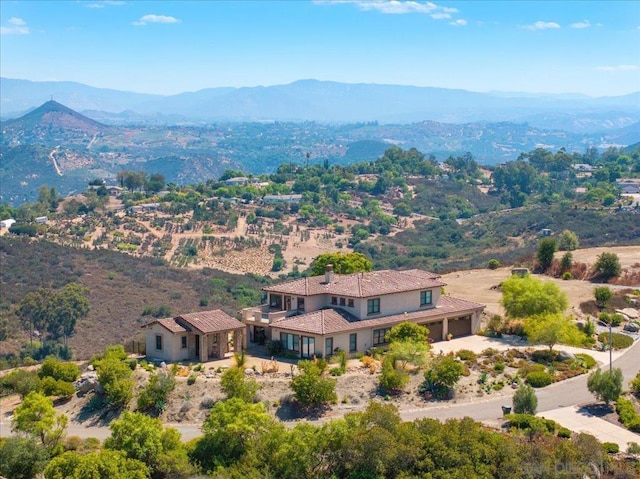 birds eye view of property with a mountain view