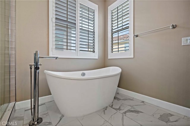 bathroom featuring a tub to relax in