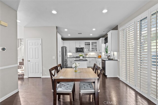 dining room with dark wood-type flooring