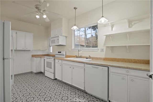 kitchen with white cabinets, white appliances, a ceiling fan, and a sink