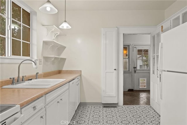 kitchen with a sink, open shelves, white cabinetry, white appliances, and light countertops