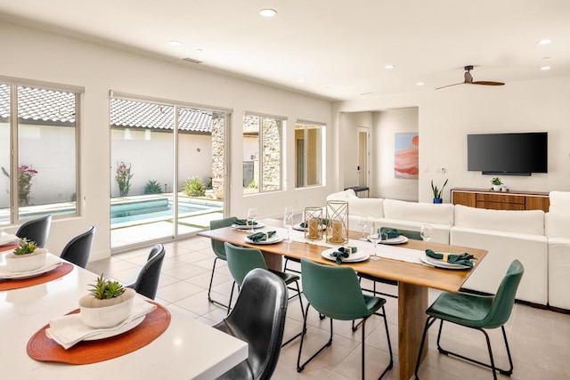 tiled dining room featuring ceiling fan