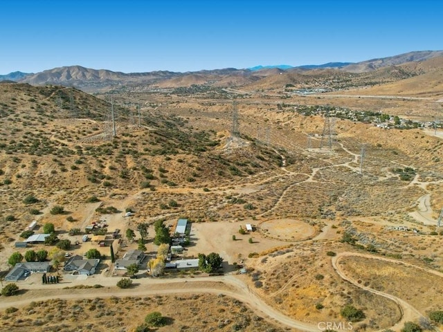 birds eye view of property featuring a mountain view