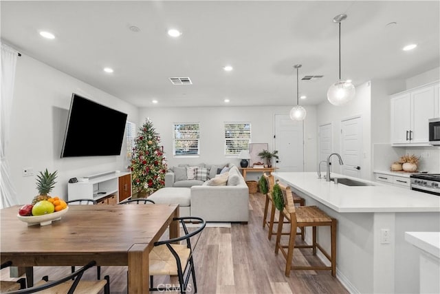 interior space with light hardwood / wood-style floors and sink