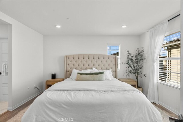 bedroom with wood-type flooring