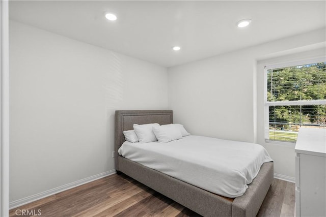 bedroom with wood-type flooring