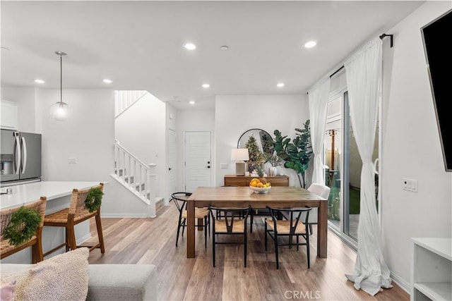 dining room with light wood-type flooring