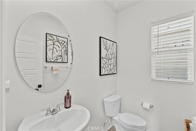 bathroom featuring sink and toilet