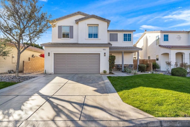 view of front facade with a garage and a front yard