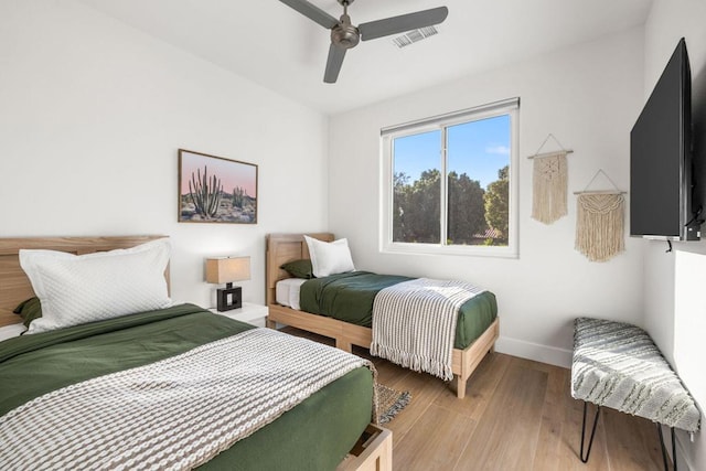 bedroom with ceiling fan and light hardwood / wood-style flooring