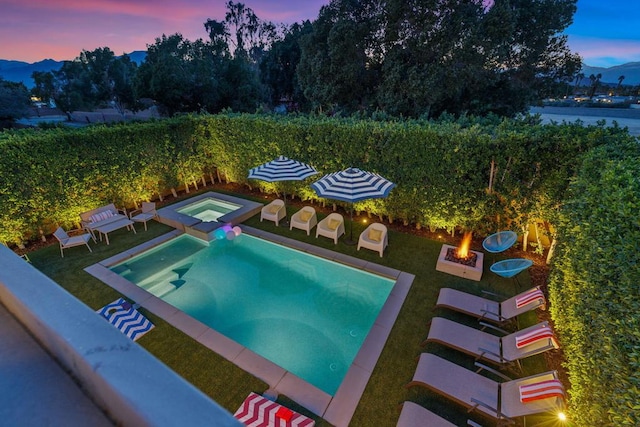 pool at dusk with a mountain view