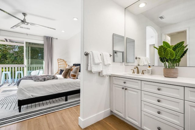 bathroom with vanity, wood-type flooring, and ceiling fan