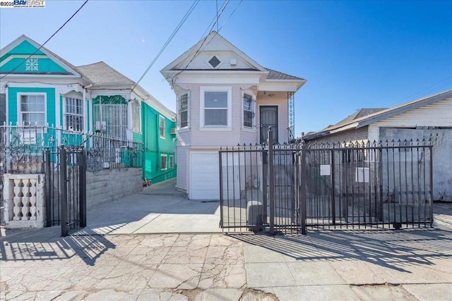 view of gate featuring a garage