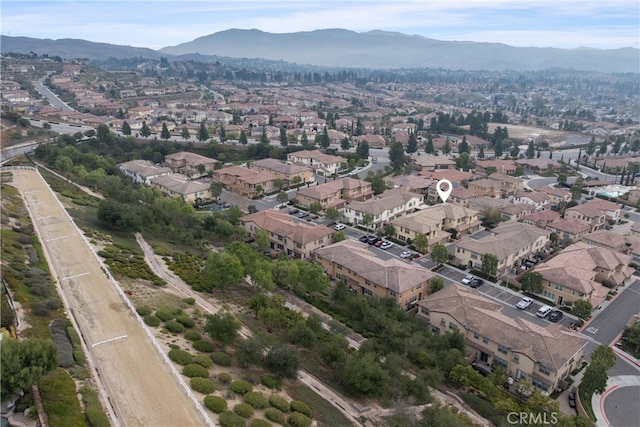 birds eye view of property with a mountain view