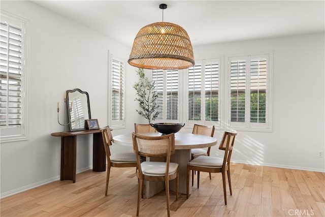 dining area with light hardwood / wood-style floors