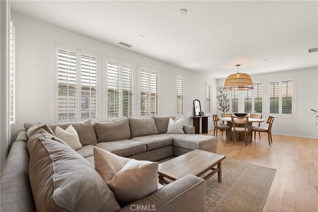 living room with light hardwood / wood-style floors