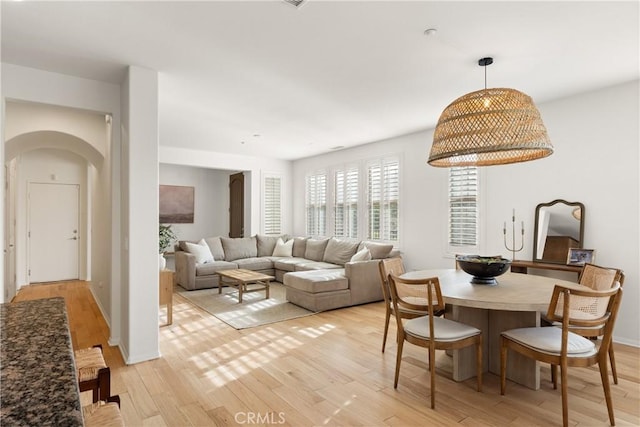 dining area with light wood-type flooring