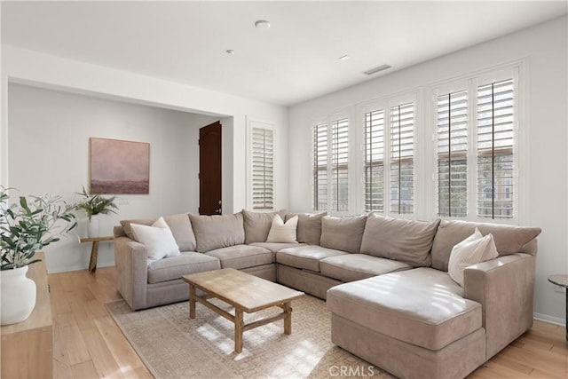 living room with light hardwood / wood-style flooring