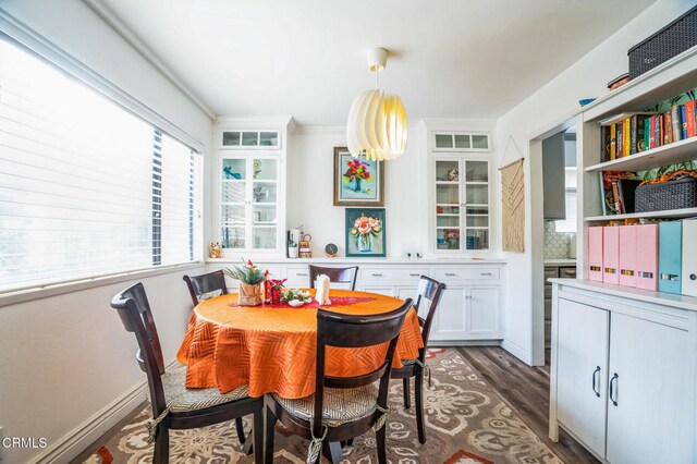 dining space with dark hardwood / wood-style floors