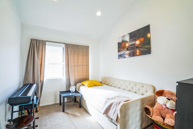 carpeted bedroom featuring lofted ceiling