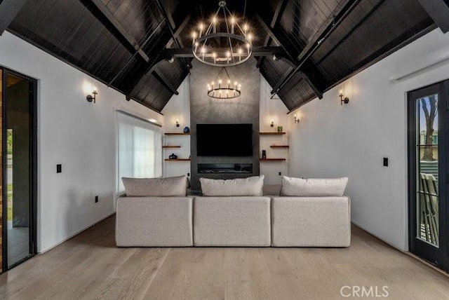 living room with beam ceiling, wood-type flooring, wood ceiling, high vaulted ceiling, and a chandelier