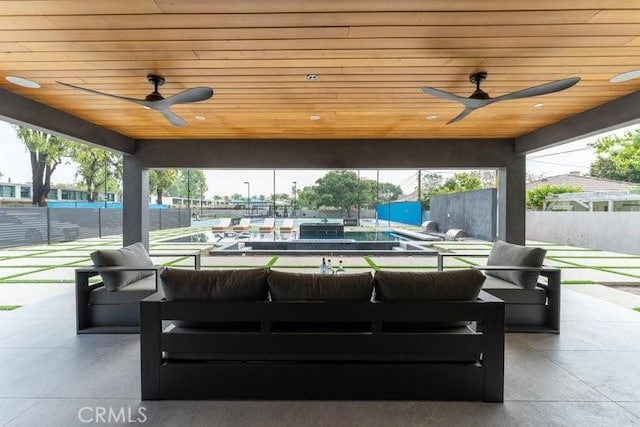 view of patio with ceiling fan and outdoor lounge area