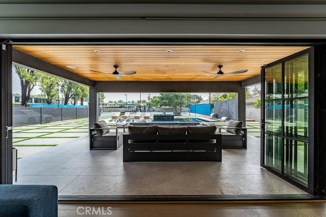 view of patio featuring an outdoor hangout area and ceiling fan