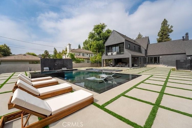 view of swimming pool featuring a patio area