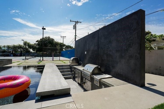 view of patio / terrace featuring area for grilling and exterior kitchen