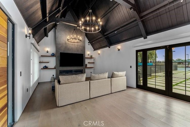 living room featuring an inviting chandelier, wood ceiling, french doors, high vaulted ceiling, and beamed ceiling