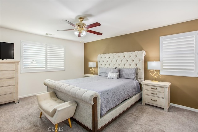 carpeted bedroom featuring ceiling fan