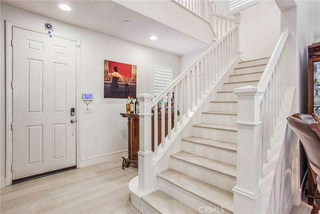 entrance foyer with light hardwood / wood-style floors