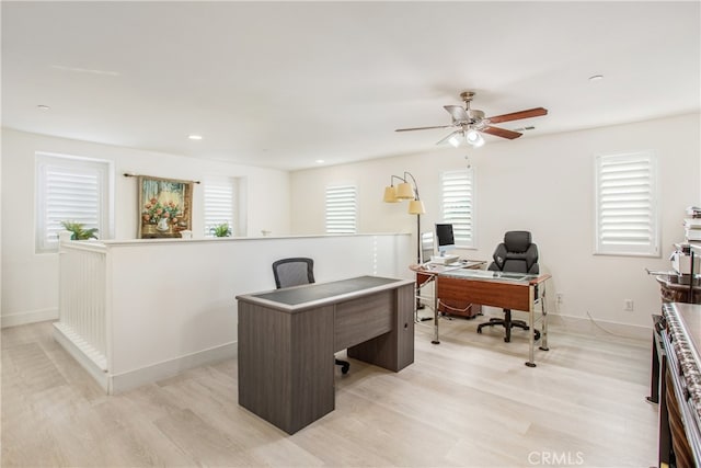 office area with ceiling fan and light hardwood / wood-style flooring