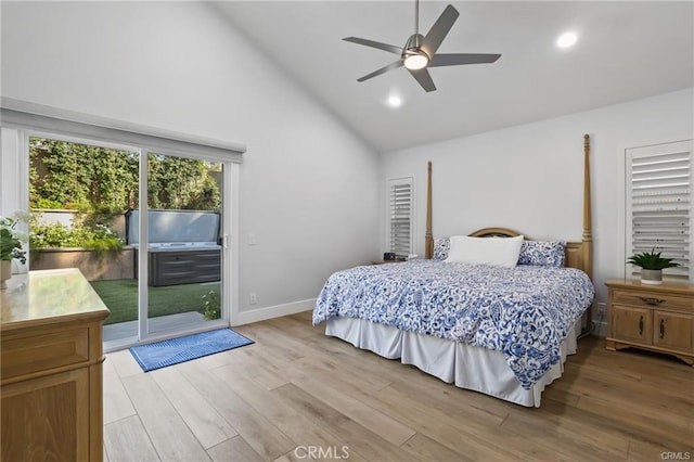 bedroom with ceiling fan, light hardwood / wood-style floors, high vaulted ceiling, and access to outside